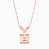 Rose gold necklace with a square-cut diamond pendant on a white background