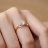 Rose gold ring with a diamond on a hand, brand 'Cheriva Jewels' visible.