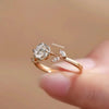Rose gold ring with diamond on a blurred background