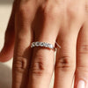 Lab grown diamond engagement ring holds pear cut side stone.