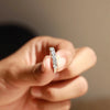 Marquise cut diamond engagement ring with pear cut side stone.
