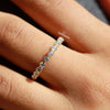 round cut diamond placed in shared prong.